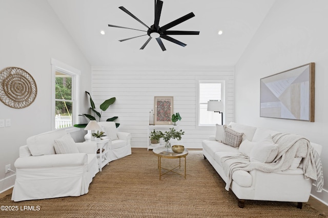 living area featuring recessed lighting, ceiling fan, baseboards, and high vaulted ceiling