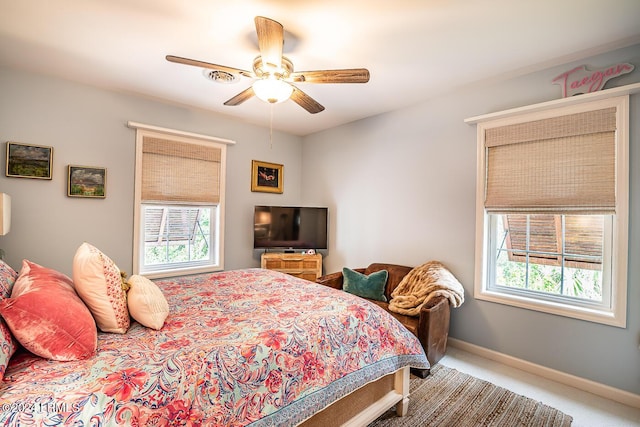 carpeted bedroom with ceiling fan