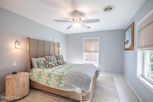 carpeted bedroom with ceiling fan