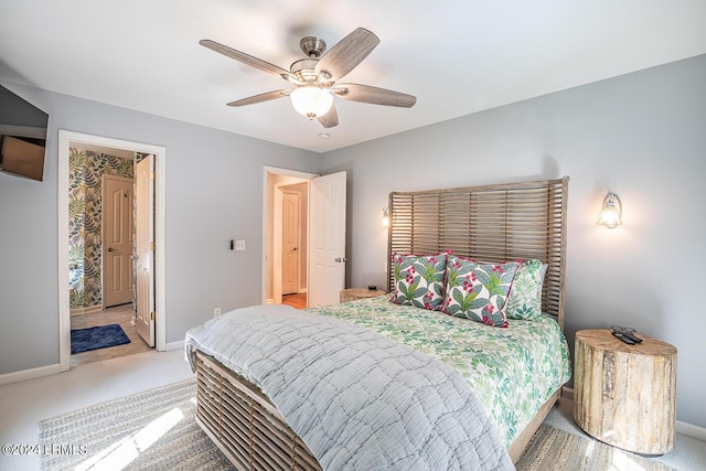 bedroom featuring light carpet and ceiling fan