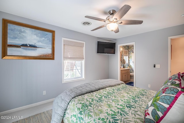 bedroom featuring connected bathroom, ceiling fan, and carpet