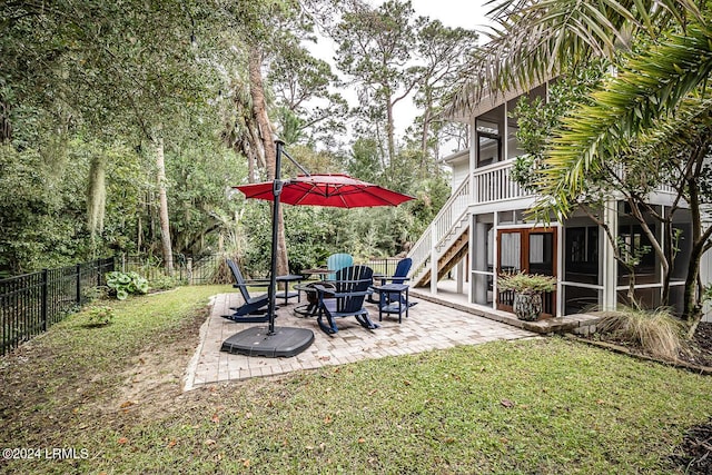 view of yard with a patio area and a sunroom