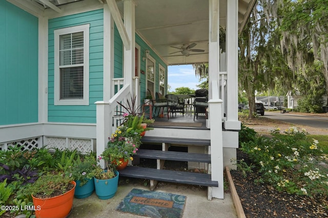 wooden terrace with a porch and a ceiling fan