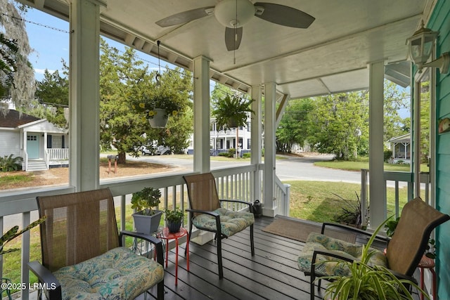 sunroom with a ceiling fan
