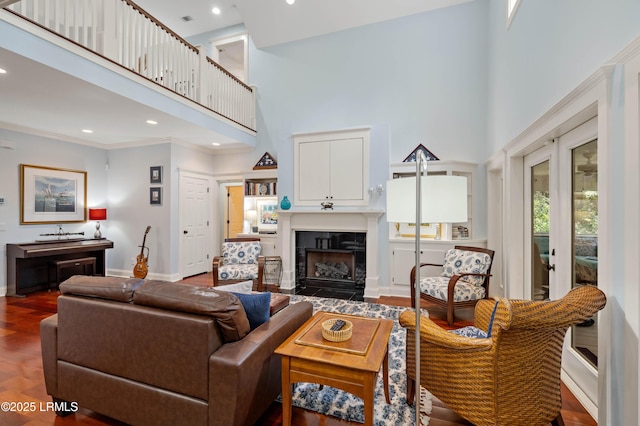 10 Old Barn Rd, Beaufort, SC 29907 - living area with a high ceiling, a premium fireplace, recessed lighting, wood finished floors, and crown molding