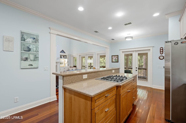 10 Old Barn Rd, Beaufort, SC 29907 - kitchen featuring stainless steel appliances, french doors, dark wood-style flooring, ornamental molding, and a kitchen island