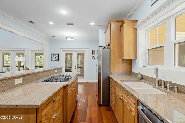 10 Old Barn Rd, Beaufort, SC 29907 - kitchen featuring french doors, appliances with stainless steel finishes, dark wood finished floors, light stone countertops, and ornamental molding