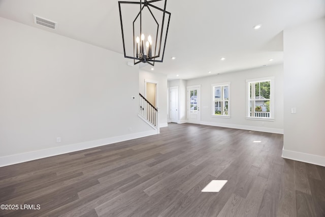 14 Skipperling Ct, Bluffton, SC 29909 - unfurnished living room with stairway, baseboards, dark wood finished floors, recessed lighting, and a chandelier