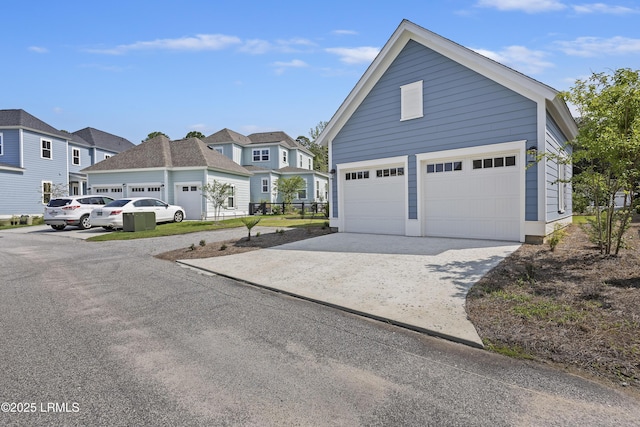 14 Skipperling Ct, Bluffton, SC 29909 - view of home's exterior featuring a garage, a residential view, and driveway