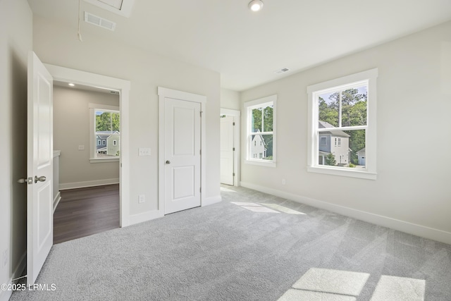 14 Skipperling Ct, Bluffton, SC 29909 - unfurnished bedroom featuring attic access, carpet floors, and baseboards