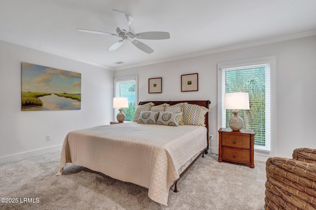 bedroom with ceiling fan, ornamental molding, and light carpet