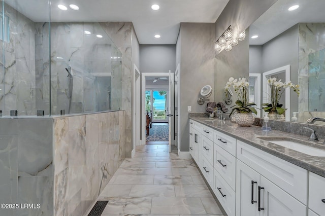 bathroom with an enclosed shower and vanity