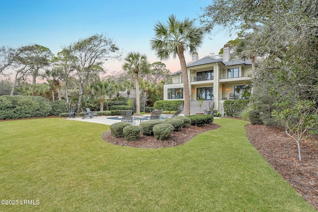 exterior space featuring a patio and a lawn