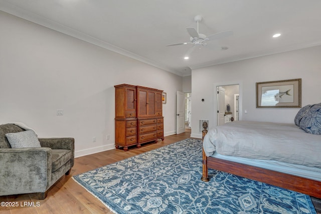 bedroom featuring crown molding, hardwood / wood-style floors, and ceiling fan