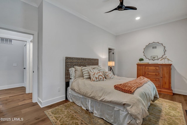 bedroom with wood-type flooring and ceiling fan