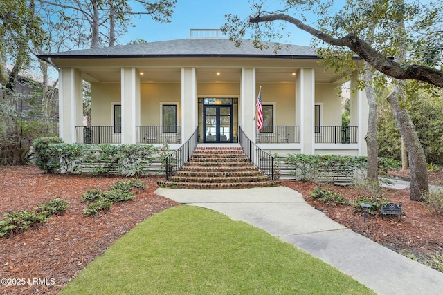 view of front of home featuring french doors and a porch