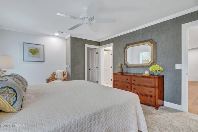 bedroom featuring crown molding, ceiling fan, and light carpet