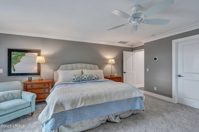 bedroom with ornamental molding, ceiling fan, and carpet