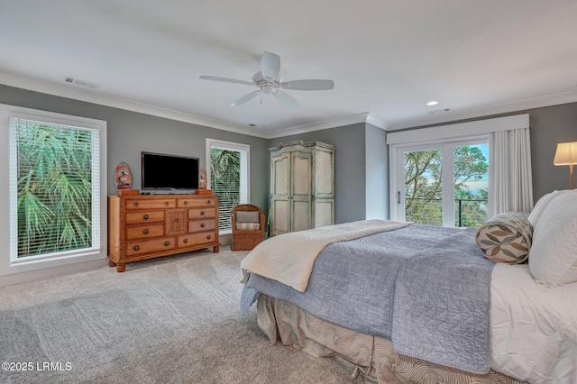 carpeted bedroom featuring crown molding and ceiling fan