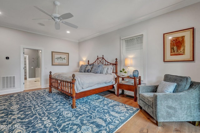 bedroom with ceiling fan, ornamental molding, and light wood-type flooring