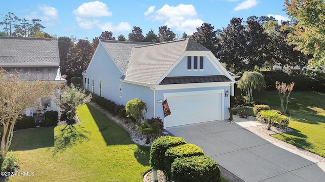 view of front of home with a garage and a front yard