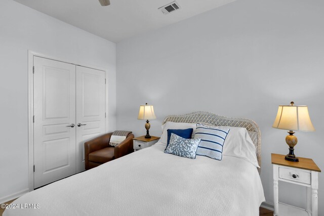 bedroom with ceiling fan and a closet