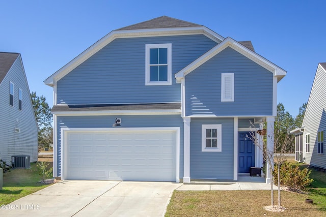 view of front facade featuring a garage, driveway, and central AC unit