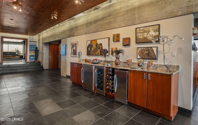 bar featuring stainless steel refrigerator, refrigerator, light stone countertops, and wooden ceiling