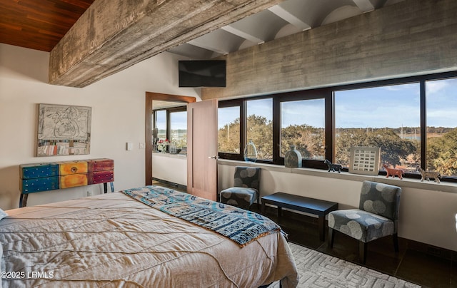 bedroom with lofted ceiling with beams and wooden ceiling