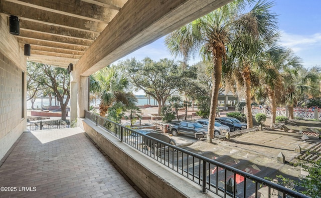 balcony featuring a water view