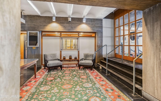 living area with beam ceiling