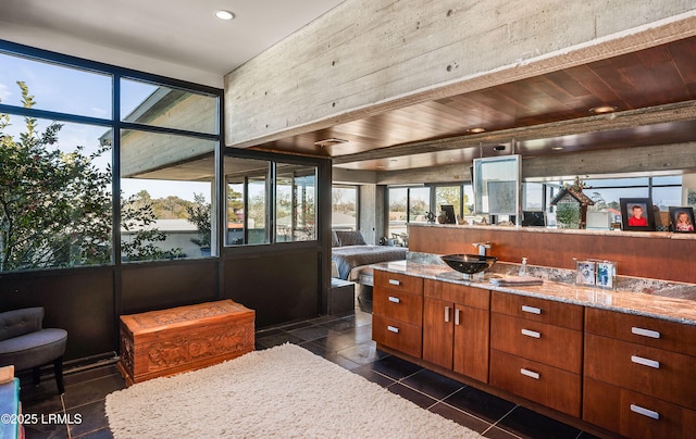 bathroom with vanity, plenty of natural light, and tile patterned floors