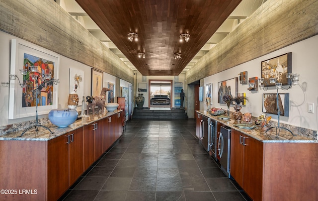 kitchen with wood ceiling, fridge, and light stone countertops