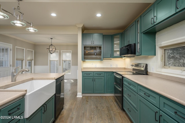 kitchen with crown molding, dark hardwood / wood-style flooring, green cabinets, pendant lighting, and black appliances