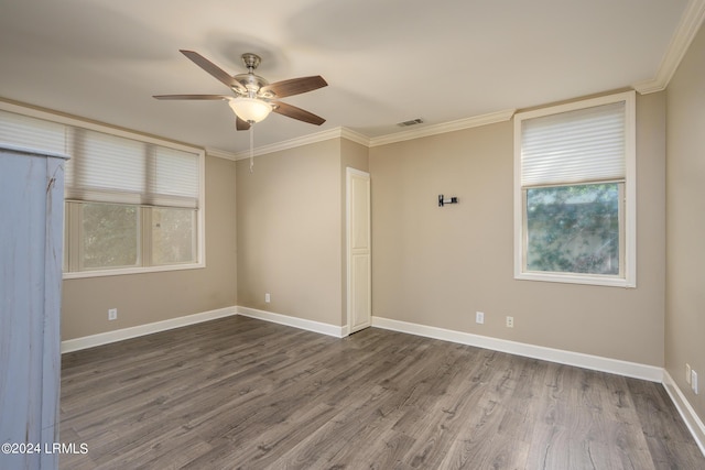 unfurnished room with crown molding, hardwood / wood-style floors, and ceiling fan