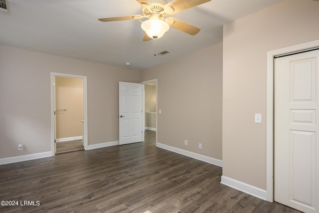 unfurnished bedroom with dark hardwood / wood-style floors and ceiling fan