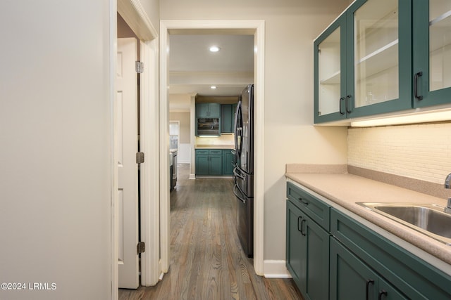 hall with sink and dark wood-type flooring