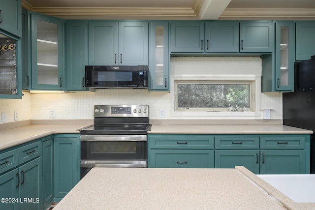 kitchen featuring decorative backsplash, black appliances, and green cabinets