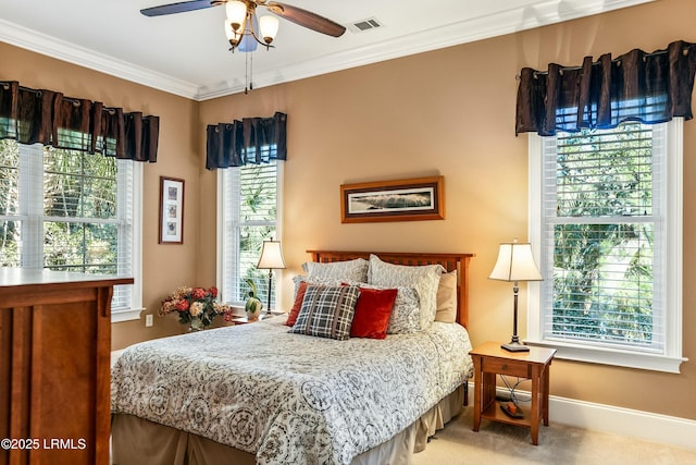 carpeted bedroom featuring ornamental molding and baseboards