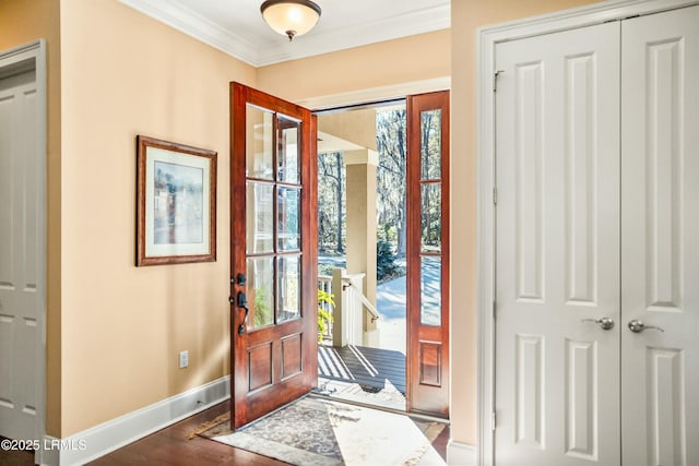 foyer entrance featuring hardwood / wood-style flooring and ornamental molding