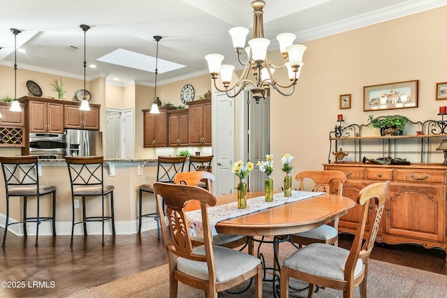 dining area featuring a notable chandelier, crown molding, a skylight, and dark hardwood / wood-style floors