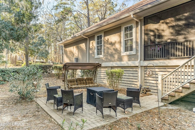 view of patio / terrace with stairway and an outdoor hangout area