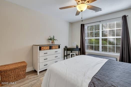 50 Pebble Beach Cv Unit F111, Bluffton, SC 29910 - bedroom with light wood-style floors and ceiling fan
