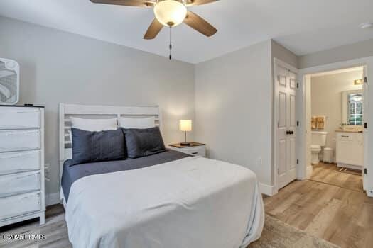 50 Pebble Beach Cv Unit F111, Bluffton, SC 29910 - bedroom featuring light wood-style floors, connected bathroom, and a ceiling fan