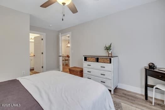 50 Pebble Beach Cv Unit F111, Bluffton, SC 29910 - bedroom with light wood finished floors, ceiling fan, and connected bathroom
