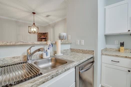 50 Pebble Beach Cv Unit F111, Bluffton, SC 29910 - kitchen featuring dishwasher, white cabinetry, decorative light fixtures, ornamental molding, and light stone counters