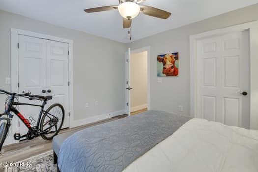 50 Pebble Beach Cv Unit F111, Bluffton, SC 29910 - bedroom featuring wood finished floors, ceiling fan, and a closet