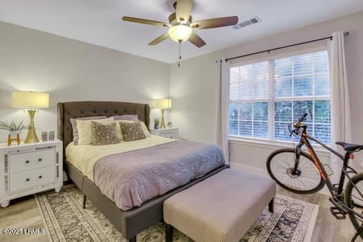 50 Pebble Beach Cv Unit F111, Bluffton, SC 29910 - bedroom with light wood-style flooring and ceiling fan