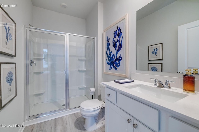 1549 Sanctum St, Ridgeland, SC 29936 - full bath featuring a shower stall, toilet, vanity, and wood finished floors