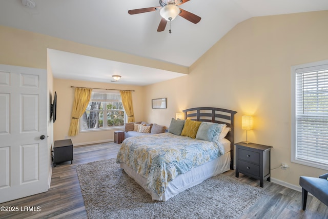 bedroom featuring lofted ceiling, a ceiling fan, baseboards, and wood finished floors